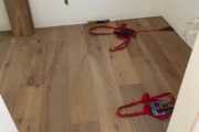 Installing French Oak flooring.