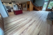 Sanding Heart Pine floors.