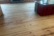 Sanding Heart Pine floors.