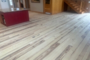 Sanding Heart Pine floors.