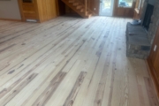 Sanding Heart Pine floors.