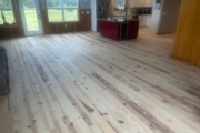 Sanding Heart Pine floors.