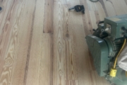 Sanding Heart Pine floors.