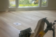 Sanding Oak floors.