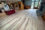 Sanding Heart Pine floors.