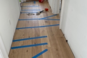 Installing European Oak hardwood flooring.