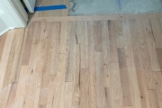 Installing engineered Red Oak flooring.