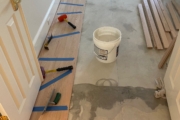 Installing engineered Red Oak flooring.