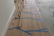 Installing engineered Red Oak flooring.