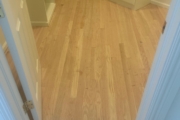 Sanding engineered Red Oak floors.