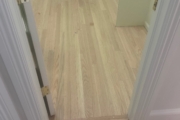 Sanding engineered Red Oak floors.