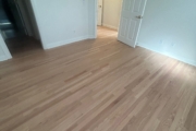 Sanding engineered Red Oak floors.