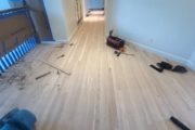 Sanding engineered Red Oak floors.