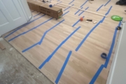 Install engineered Red Oak flooring.