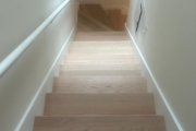 Install engineered Red Oak flooring.