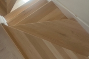 Install engineered Red Oak flooring.