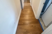 Refinished Red Oak flooring.