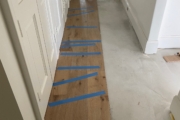 Installing 8" wide French Oak hardwood flooring.