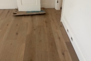 Installing 8" wide French Oak hardwood flooring.