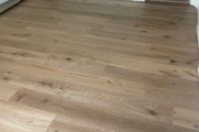 Installing 8" wide French Oak hardwood flooring.