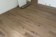 Installing 8" wide French Oak hardwood flooring.