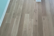 Installing White Oak flooring.