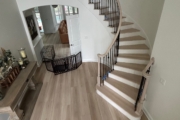 Match stained staircase and LPV floor.
