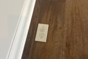 Installed Oak flooring/in floor electrical outlet.
